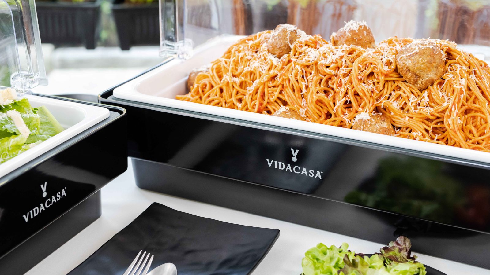 Black Universal GN buffet set with hot pasta under a roll-top lid and a blue C1 cold cell seated in the open well beside it
